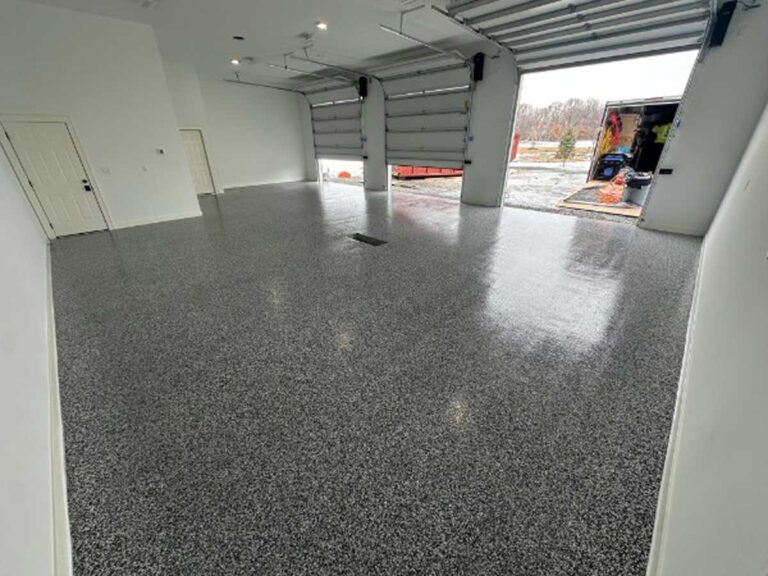 1,180 sq. ft. garage floor coating in Wyoming, MN featuring Quartzsite flake finish and Rapid Shield polyurea system by Grizzly Concrete Coatings.